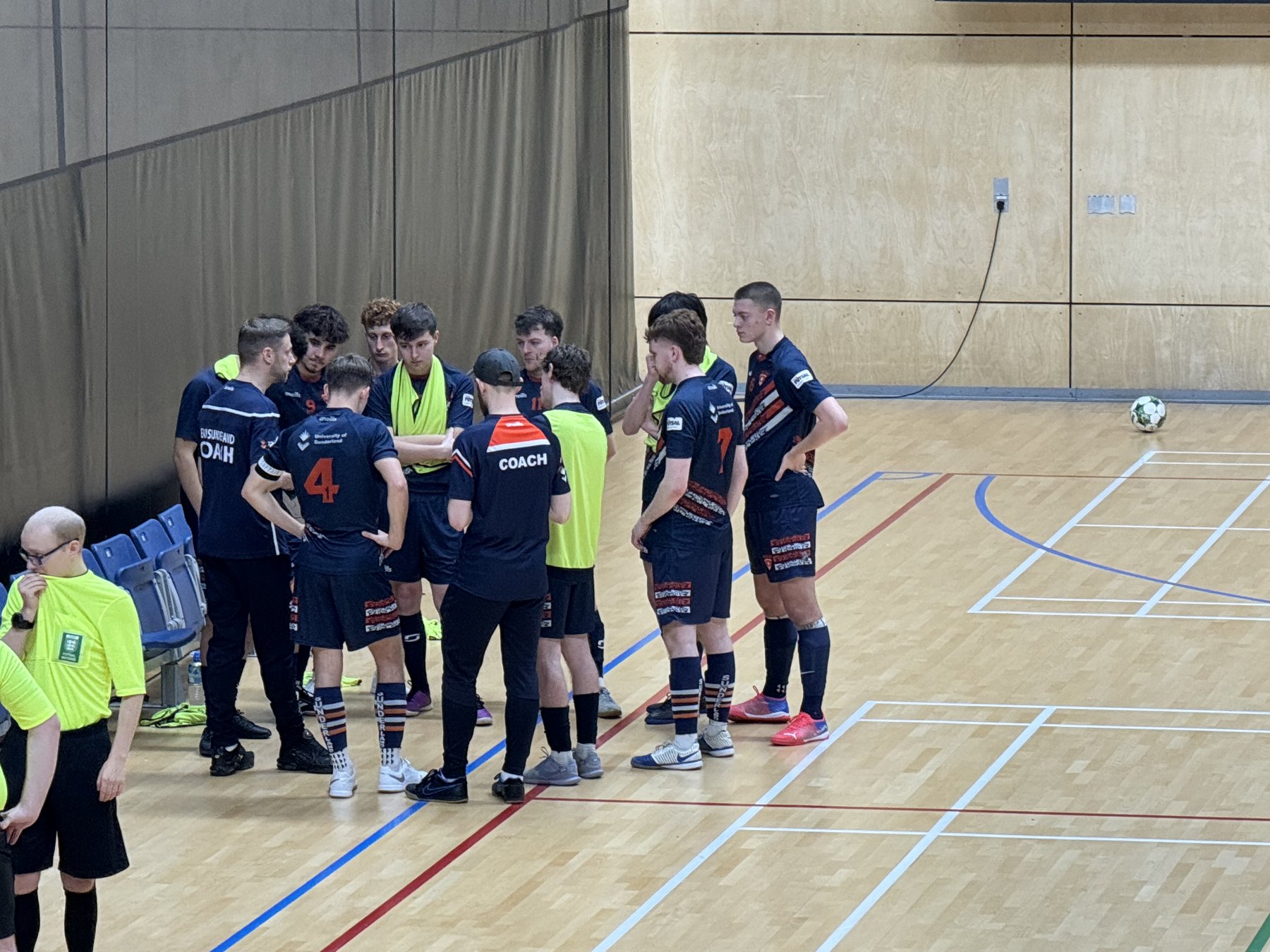 Team Sunderland Futsal squad in a courtside huddle